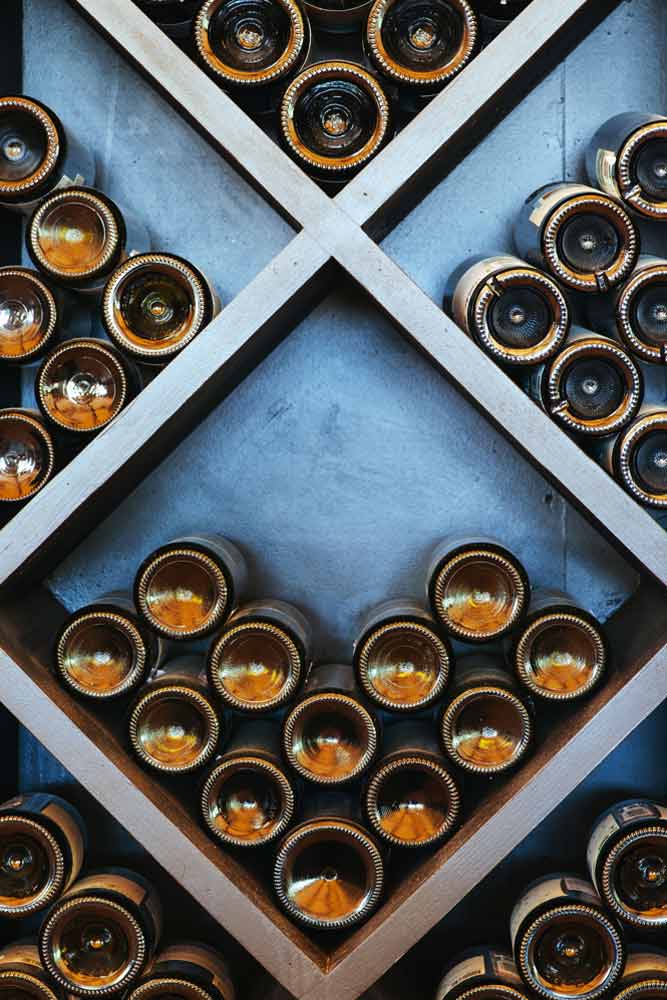 Wine cellar with bottles stacked in diamond racks